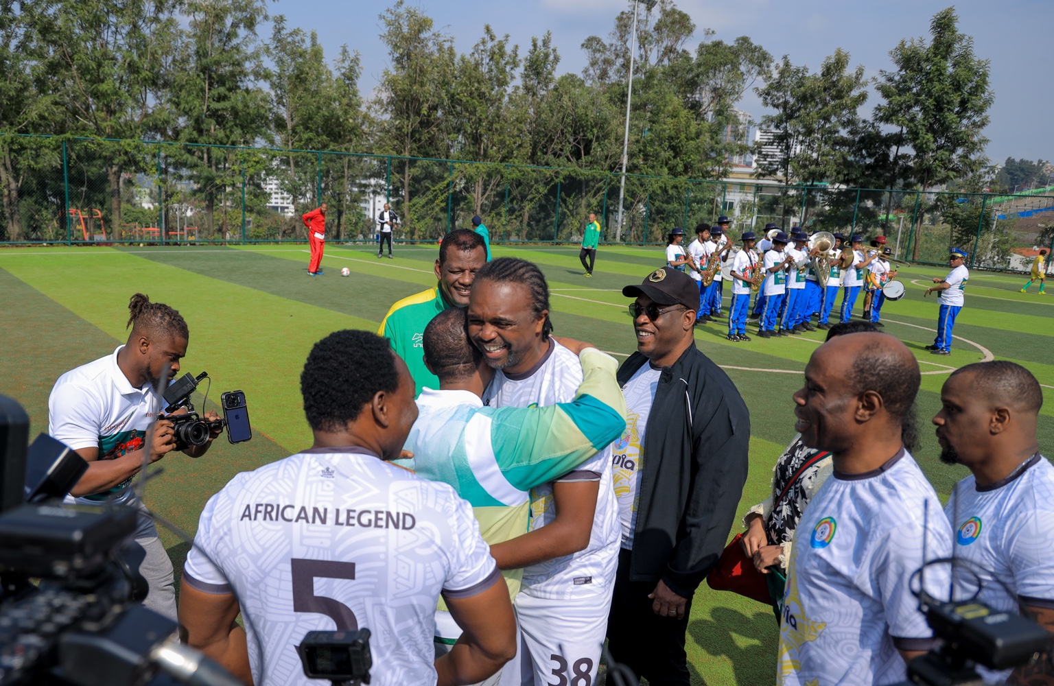 Behind-the-scenes activity and media coverage at the football gathering